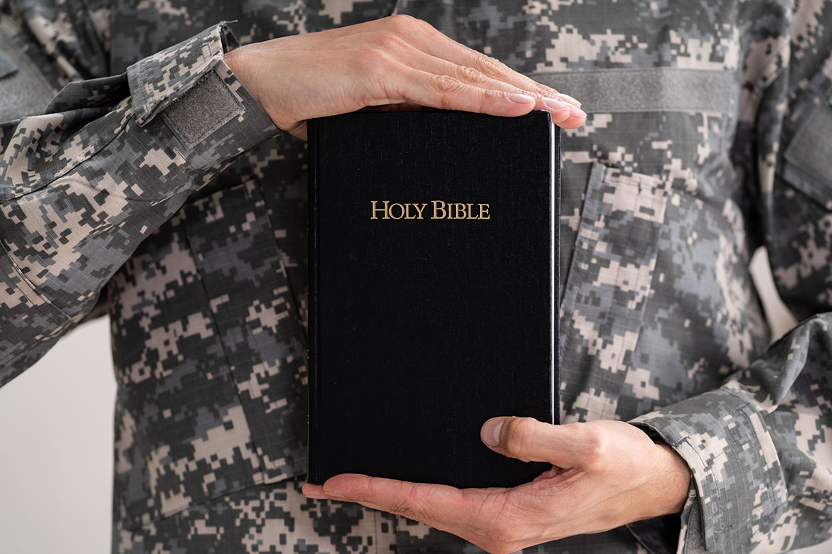 Soldier Holding Bible
